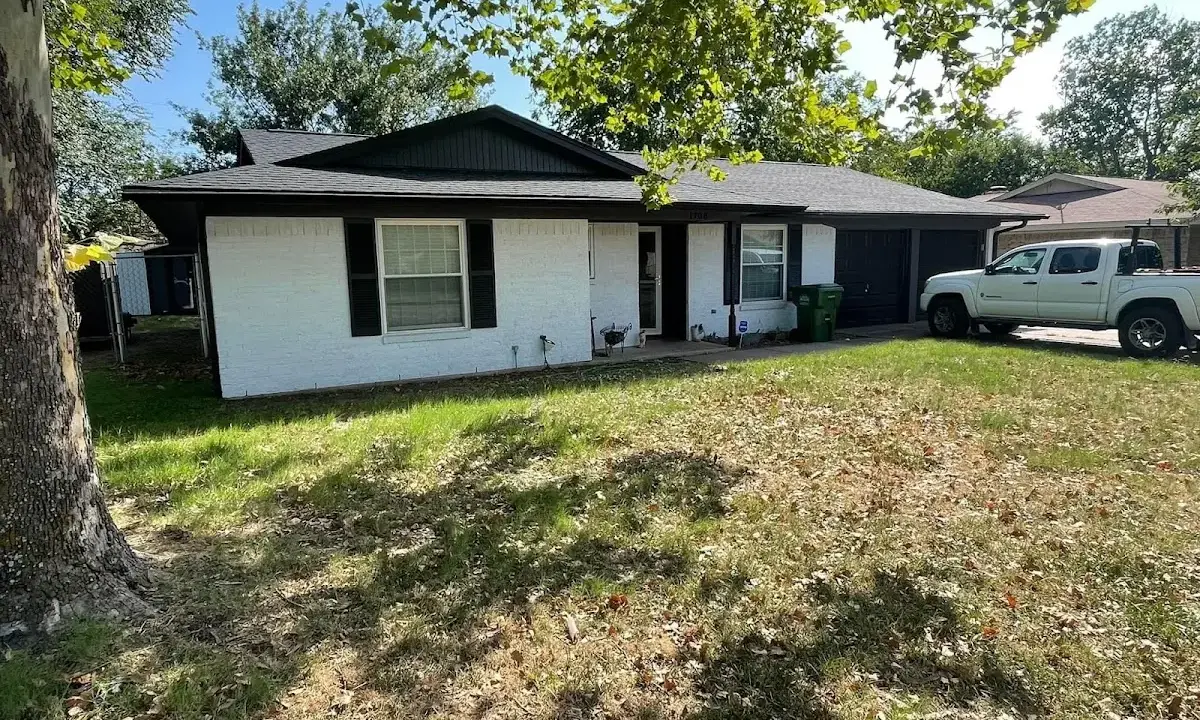 Professional roofing crew working on a residential roof in Mishawaka